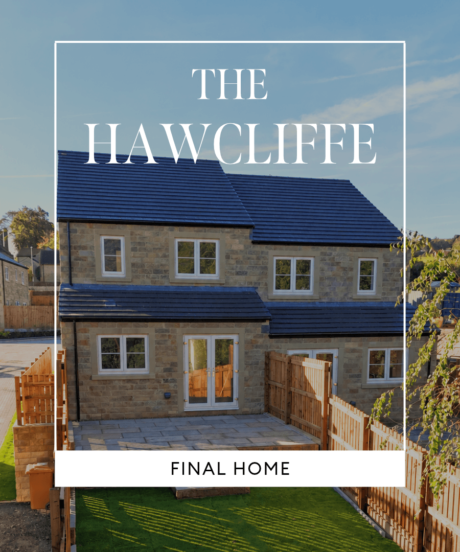 Rear view of The Hawcliffe, the final home at The Carriages, featuring a natural stone exterior, patio area and enclosed garden.
