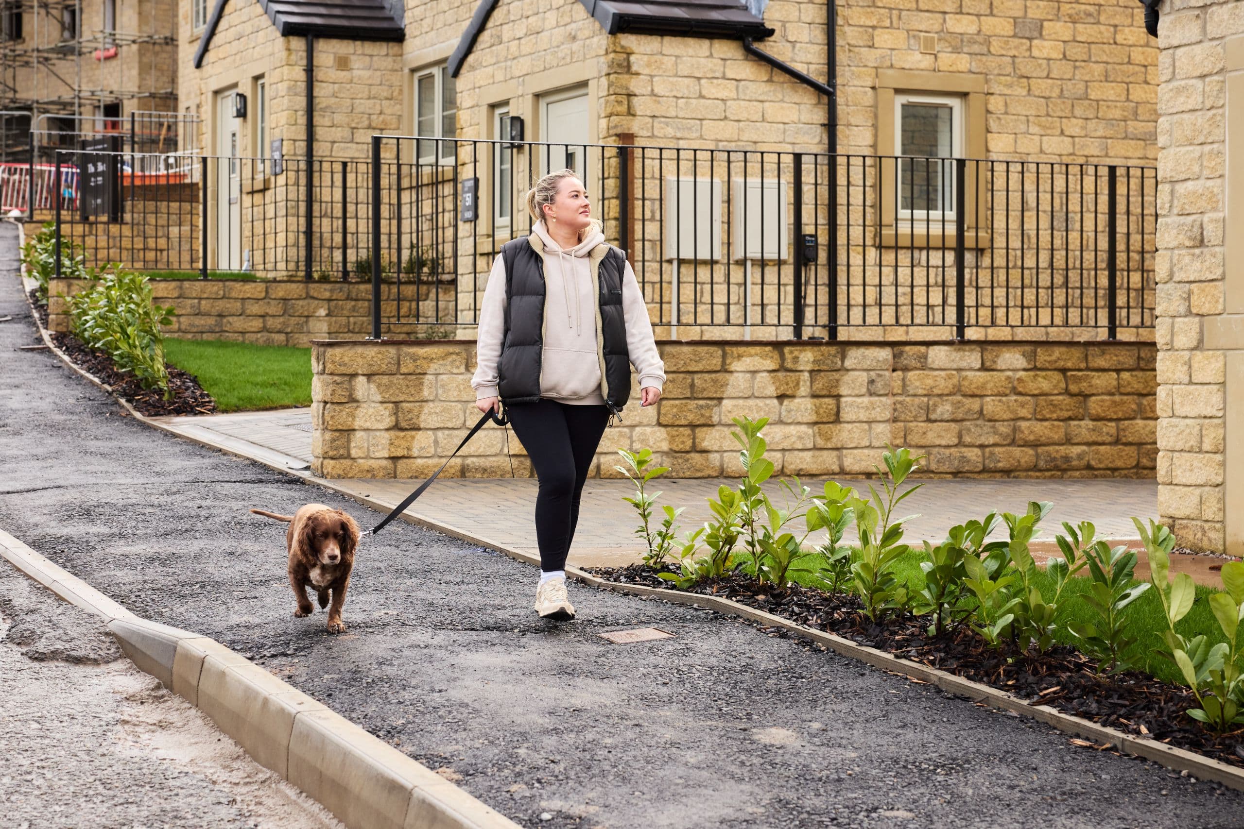 mya and dog walking the oaks street scene