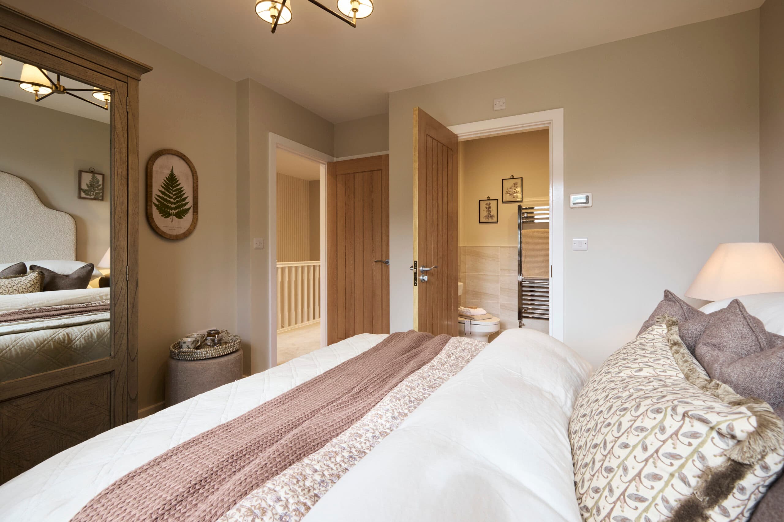 Elliot show home - bedroom 1 looking into ensuite and hallway