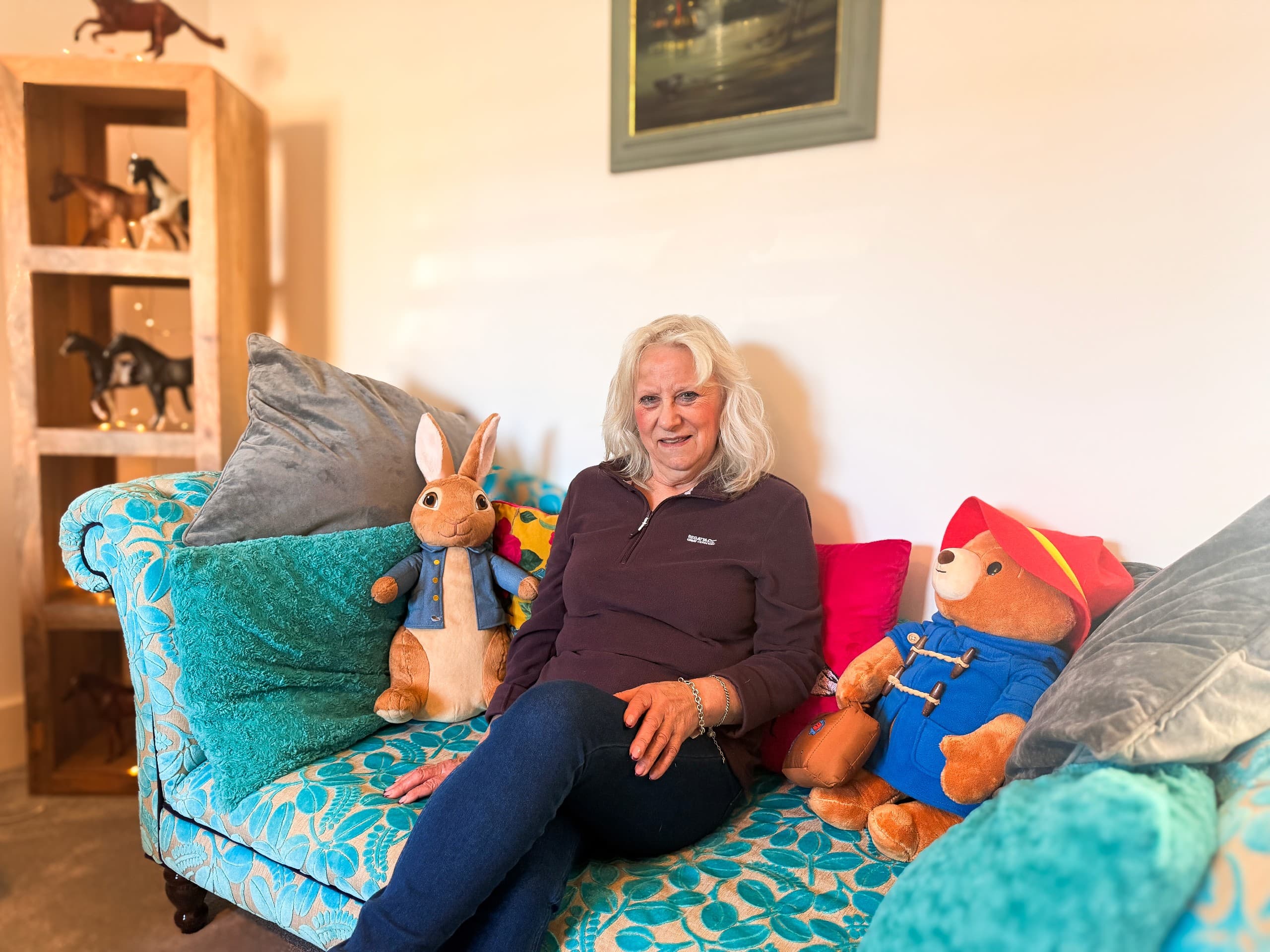 case study image of jane sat on her sofa in The lark living room