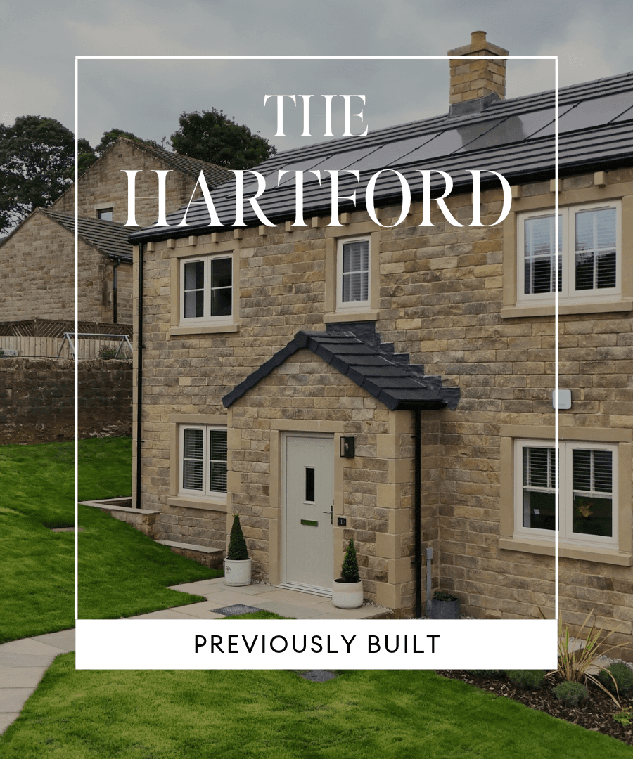 Previously built Hartford home featuring natural stone walls, a dark tiled roof, cream-framed windows and a landscaped front garden. Text overlay reads ‘The Hartford – Previously Built